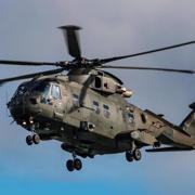  Huge helicopter swoops low over Devon beach