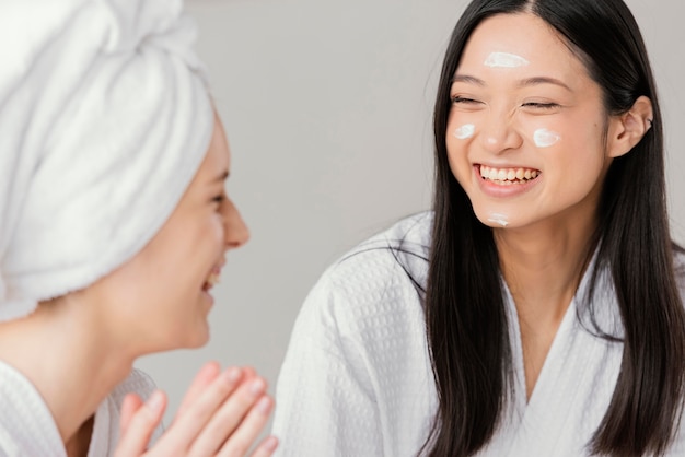 Free Photo best friends having a beauty treatment at home