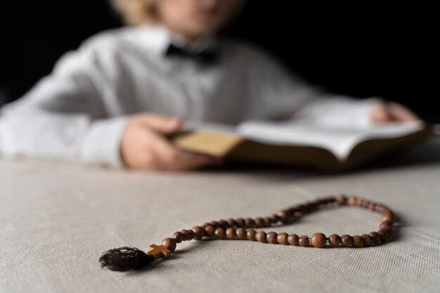 Close up blurry kid holding bible