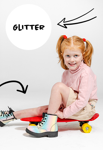 Colorful glitter girls boots from Spendless AU worn by a child on a skateboard.